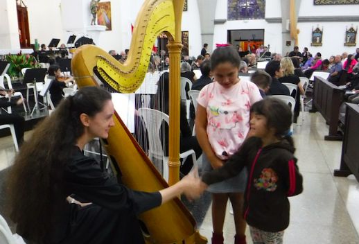 Orchestra Harpist Christina Kopriva Greets Admirers after Concert in Paraiso Church June 20